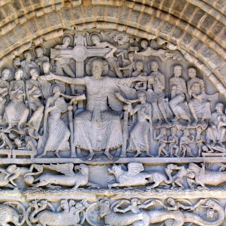 Carving of Return of Christ on tympanum of south portal, abbey church of Beaulieu-sur-Dordogne, limousin, France.